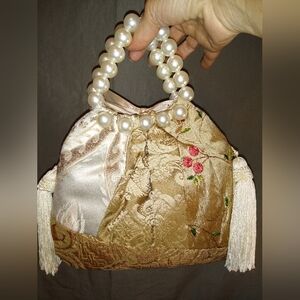 Beige embroidered beaded potli bag
